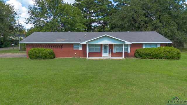 ranch-style house with a front yard and covered porch