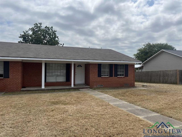 ranch-style home with roof with shingles, crawl space, fence, a front lawn, and brick siding