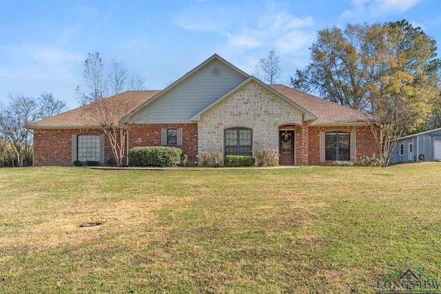 ranch-style home featuring a front lawn