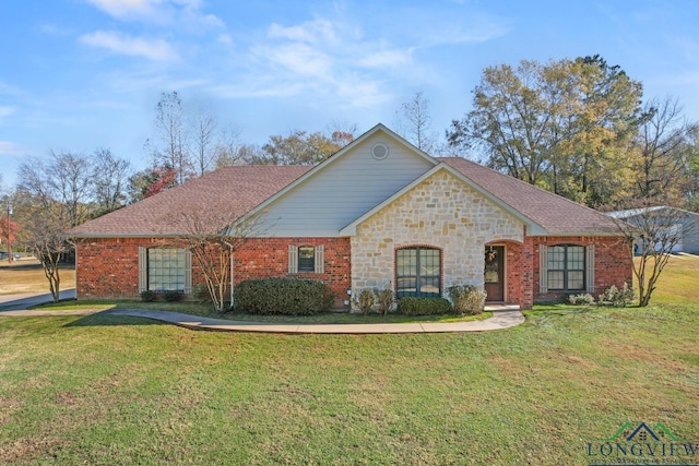 ranch-style home featuring a front yard