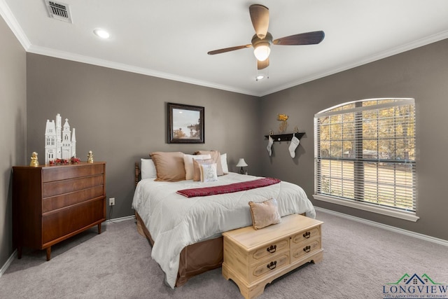 bedroom with ceiling fan, light carpet, and ornamental molding