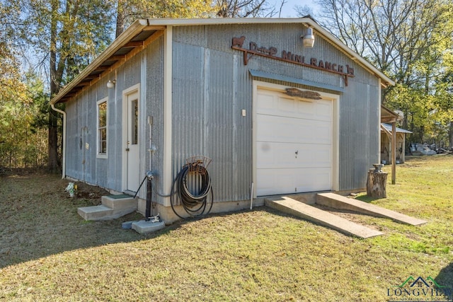 garage featuring a yard