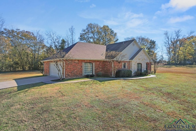 view of front of property with a garage and a front yard