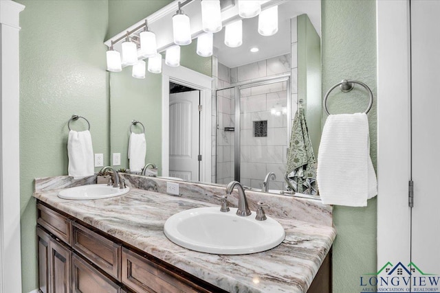 bathroom featuring vanity and an enclosed shower