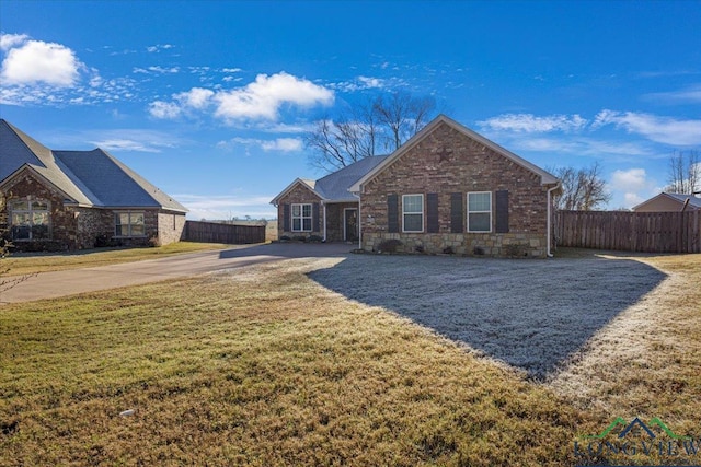 ranch-style house with a front yard