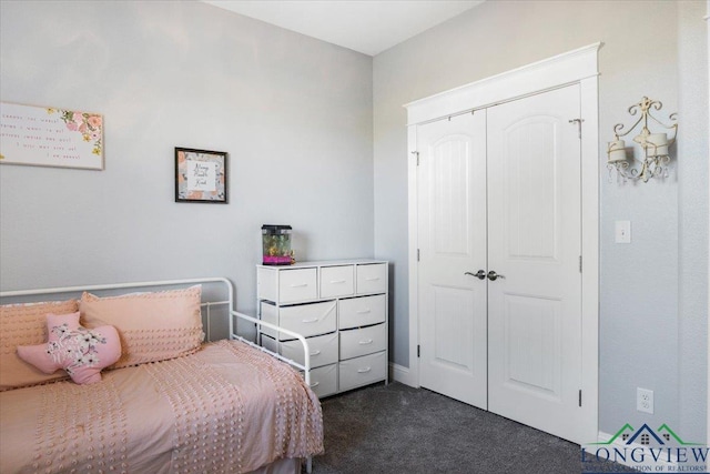 carpeted bedroom with a closet