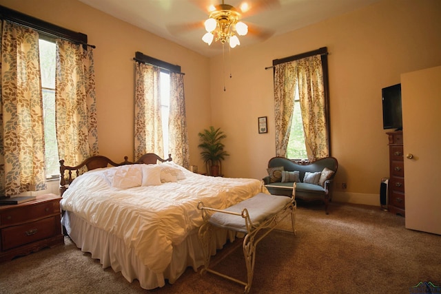 800 E Austin St, Marshall, TX 75670 - carpeted bedroom featuring a ceiling fan