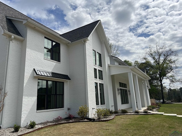 view of home's exterior featuring a lawn