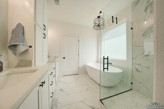 bathroom featuring vanity, separate shower and tub, and an inviting chandelier