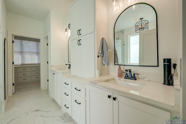 bathroom featuring vanity and a healthy amount of sunlight