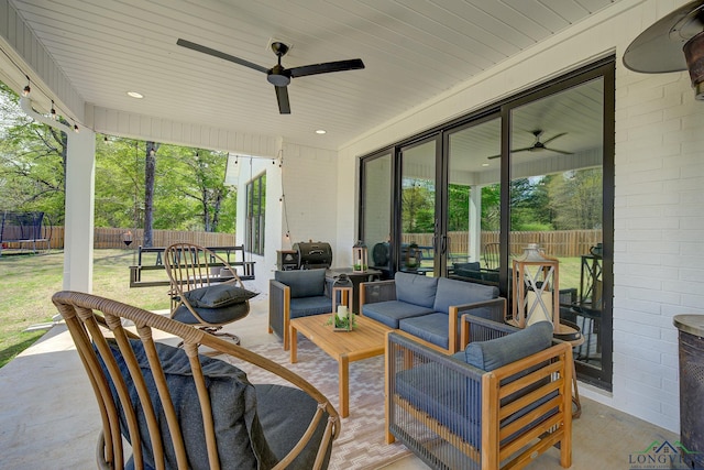 view of patio featuring a trampoline and an outdoor hangout area