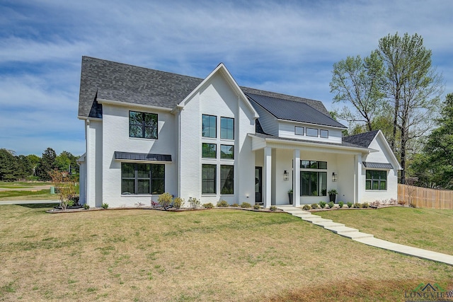 modern farmhouse featuring a front yard