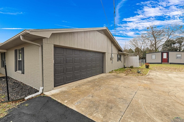 view of side of home with a garage