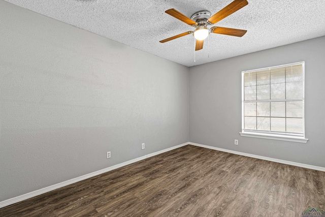 spare room featuring a textured ceiling, ceiling fan, and dark hardwood / wood-style flooring