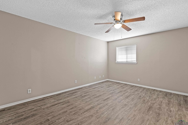 spare room with hardwood / wood-style flooring, a textured ceiling, and ceiling fan