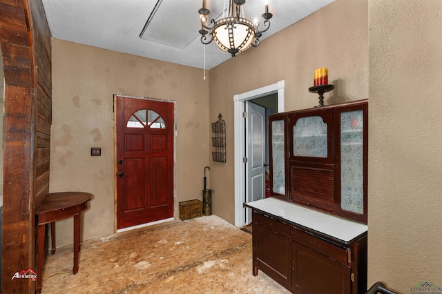 foyer entrance with an inviting chandelier