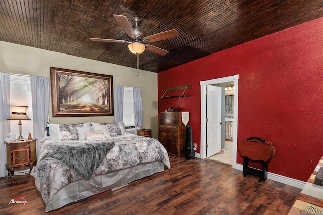 bedroom with ceiling fan, ensuite bathroom, hardwood / wood-style floors, and wooden ceiling