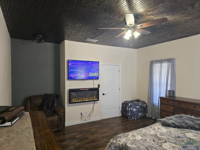 bedroom with ceiling fan, ensuite bathroom, hardwood / wood-style floors, and wooden ceiling