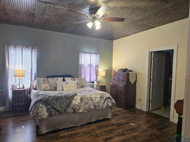 hall featuring sink, dark hardwood / wood-style floors, and wood walls