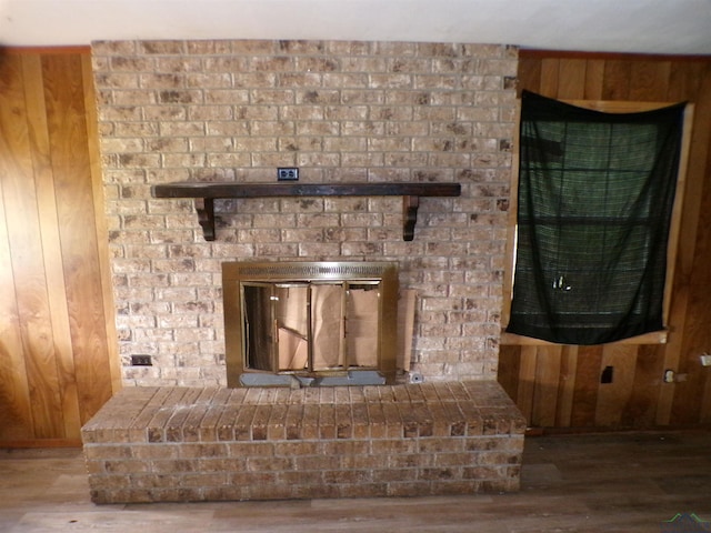 details featuring wooden walls and hardwood / wood-style flooring