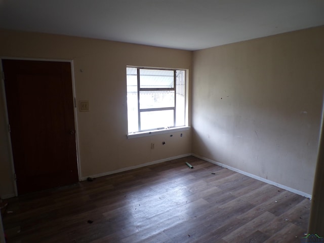 empty room featuring dark hardwood / wood-style floors