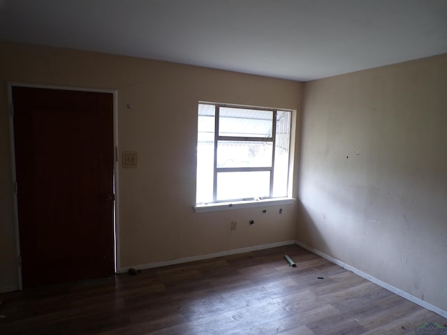 empty room with wood-type flooring