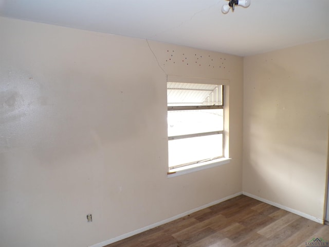 spare room featuring light wood-type flooring