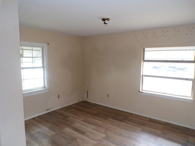 empty room with hardwood / wood-style floors