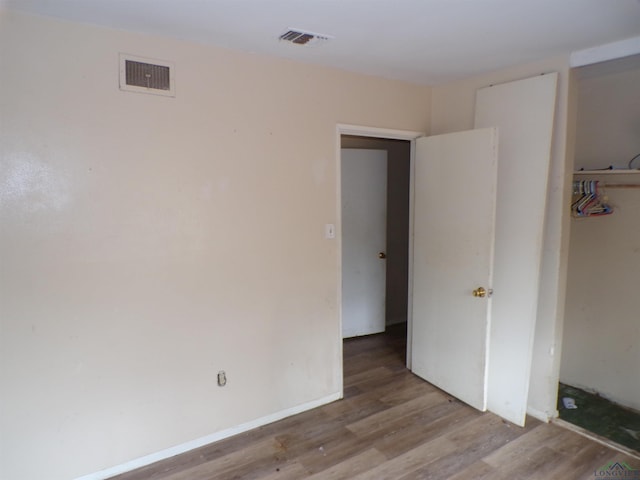 spare room with light hardwood / wood-style floors