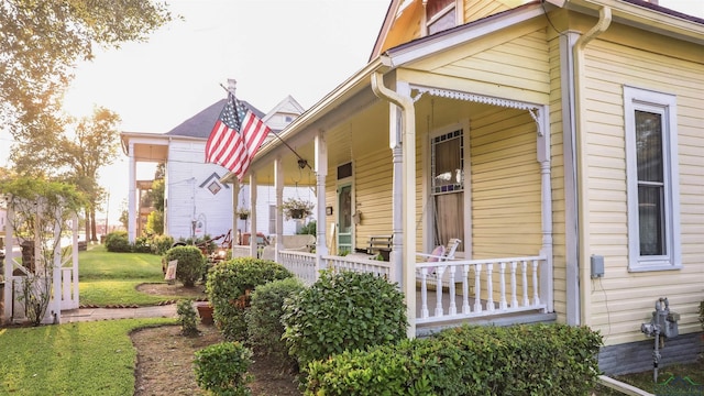 view of side of property with a porch