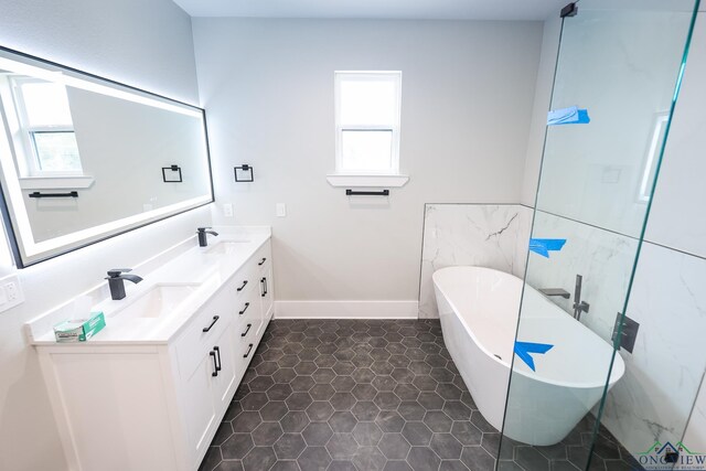 bathroom with vanity and a tub to relax in