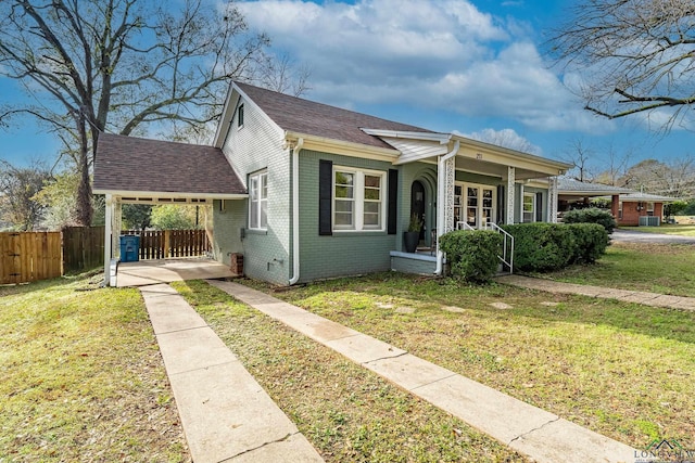 bungalow-style house featuring a porch and a front lawn