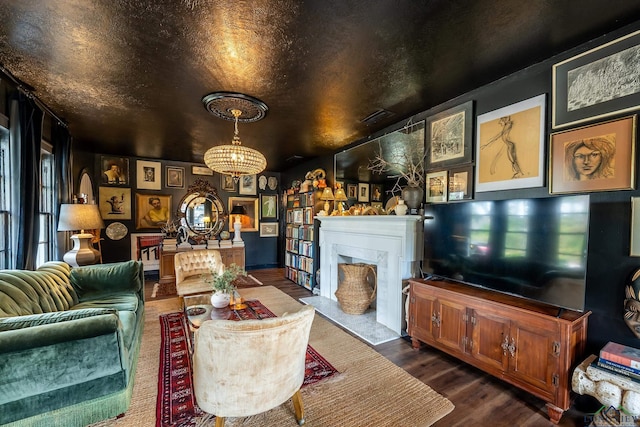 living room featuring dark hardwood / wood-style flooring and a chandelier