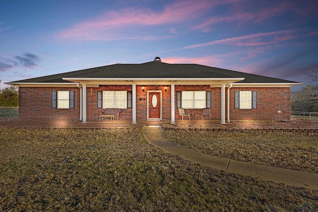 single story home with covered porch