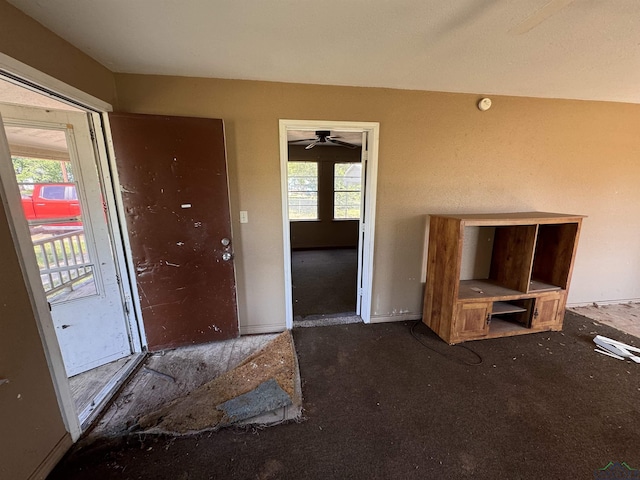 entrance foyer with ceiling fan