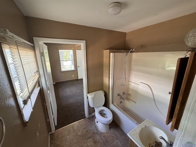 bathroom featuring toilet and shower / bathtub combination