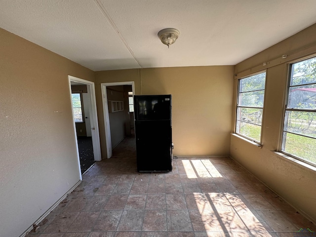 582 E Main St, Van, TX 75790 - unfurnished dining area featuring plenty of natural light and stone finish flooring