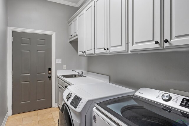 1303 Lesley, Longview, TX 75604 - laundry area with light tile patterned floors, independent washer and dryer, crown molding, a sink, and cabinet space