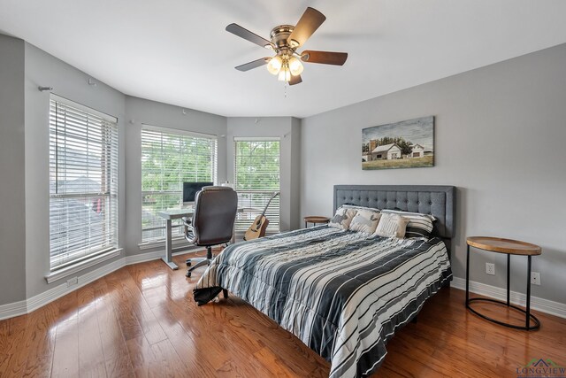 1303 Lesley, Longview, TX 75604 - bedroom with a ceiling fan, wood finished floors, and baseboards