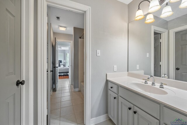 1303 Lesley, Longview, TX 75604 - bathroom featuring vanity, visible vents, tile patterned floors, and baseboards