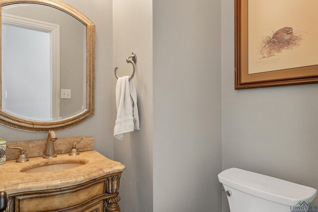 1303 Lesley, Longview, TX 75604 - half bathroom with toilet and vanity