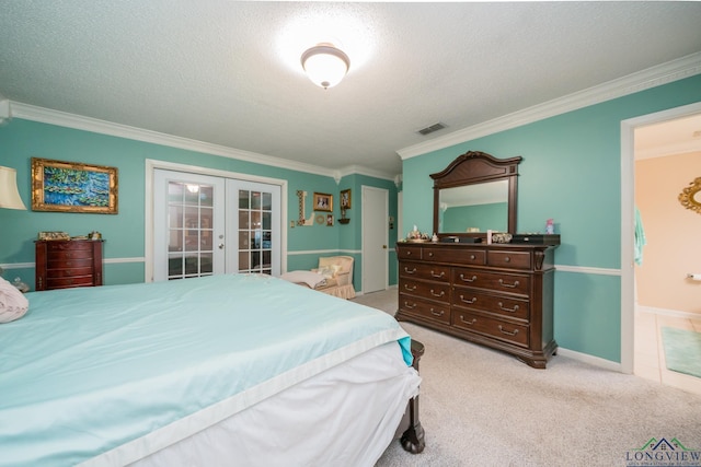 carpeted bedroom featuring access to exterior, ornamental molding, french doors, and a textured ceiling