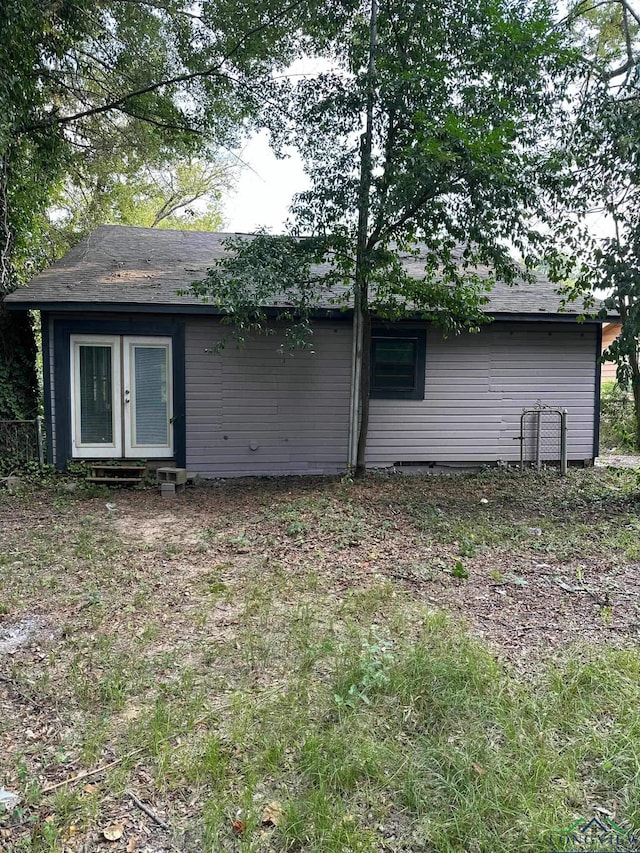 rear view of property with french doors