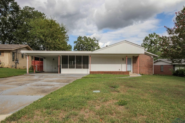 ranch-style home with a front lawn and a carport