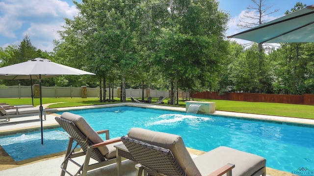 view of pool featuring pool water feature and a lawn