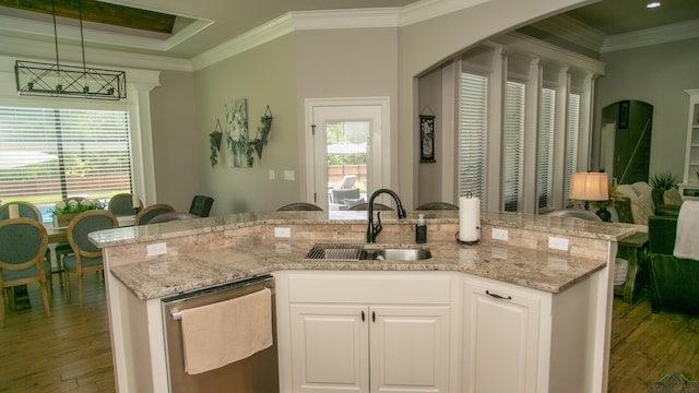 kitchen featuring ornamental molding, sink, pendant lighting, dishwasher, and white cabinetry