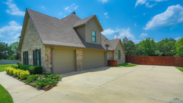 view of property exterior featuring a garage