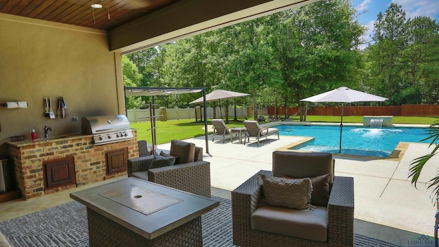 view of swimming pool with area for grilling, pool water feature, a yard, and a patio