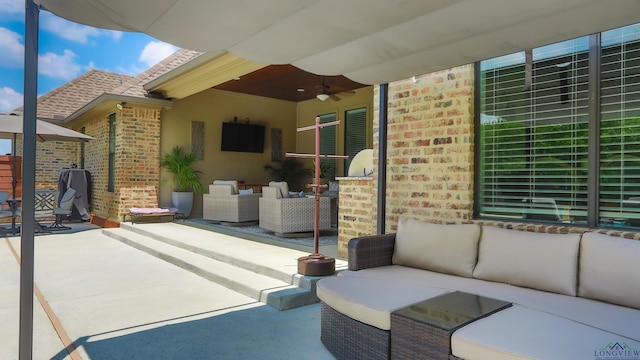 view of patio / terrace with ceiling fan and an outdoor hangout area