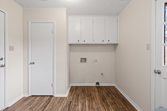 clothes washing area with cabinet space, dark wood finished floors, a textured ceiling, hookup for an electric dryer, and washer hookup